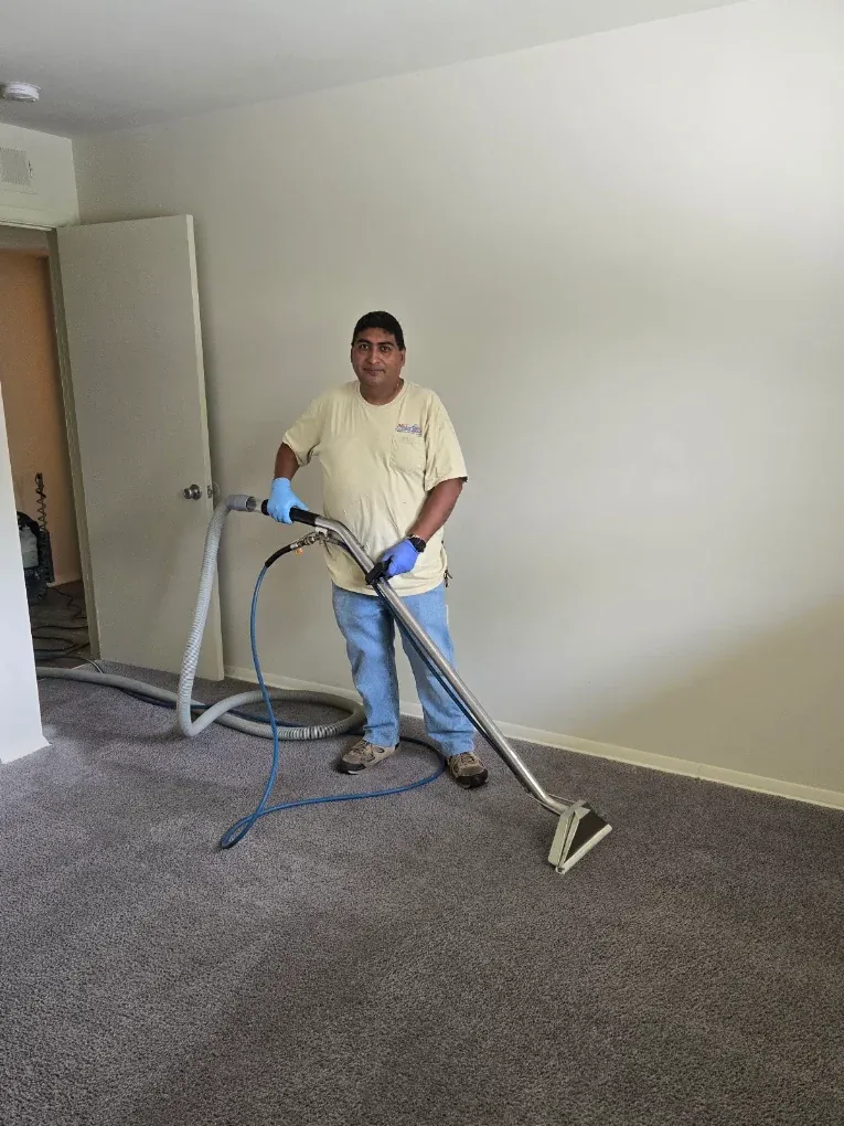 Nice Pro technician steam cleaning carpet in a Rockville, MD home