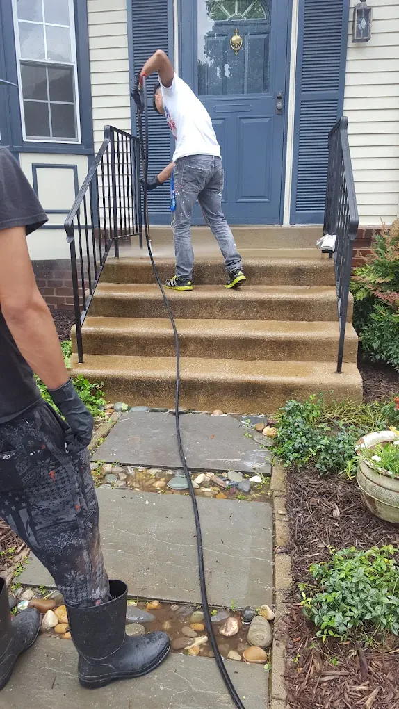 Pressure washing front entry steps of a Rockville, MD home