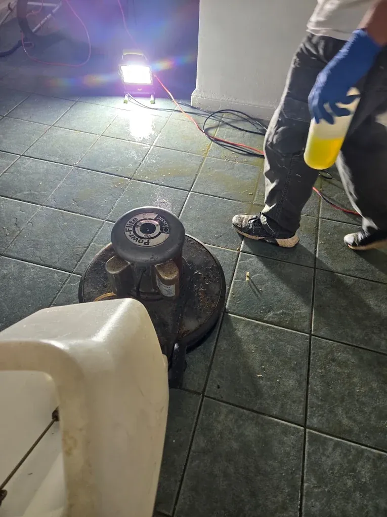 Tile floor machine scrubbing during tile and grout cleaning